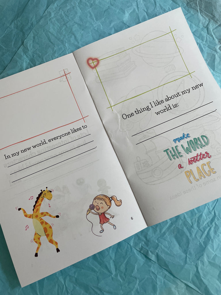 Children's activity book with writing prompts and illustrations on a blue textured surface