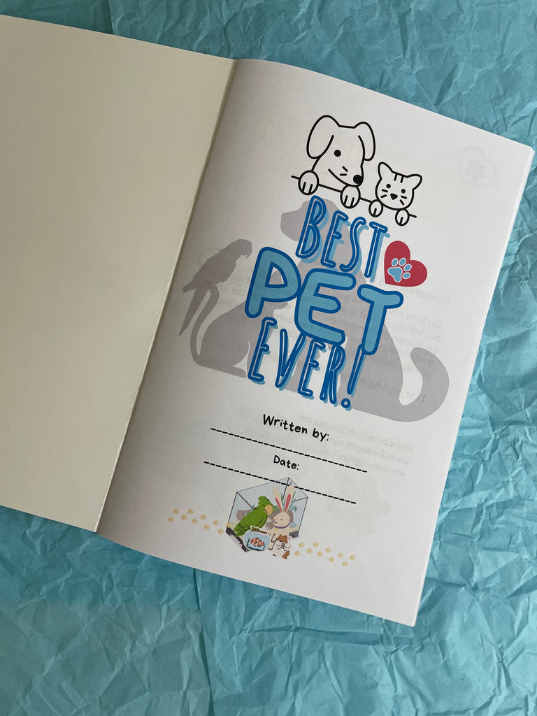 Book with 'Best Pet Ever!' text on a blue textured surface