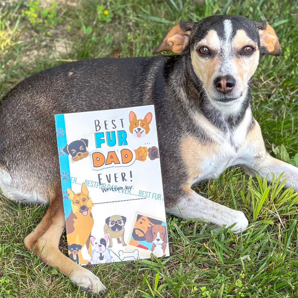 best fur dad book laying on a dog