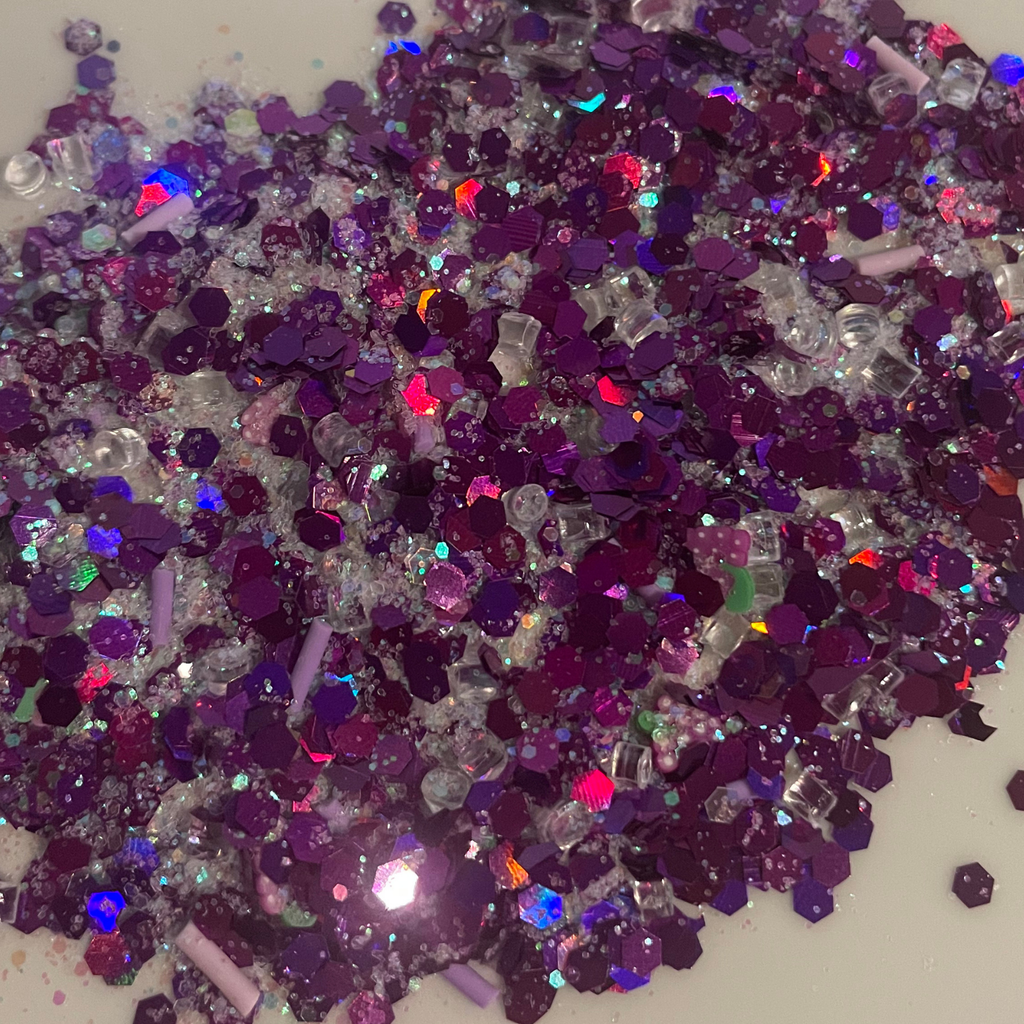 Grape Snow Cone Slime's Colorful glitter mix on a white background