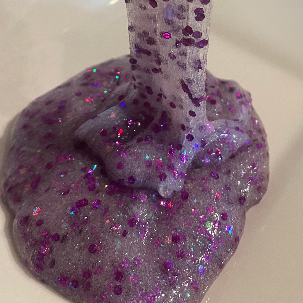 Grape Snow Cone Slime, Purple glitter slime drizzle  on a white background
