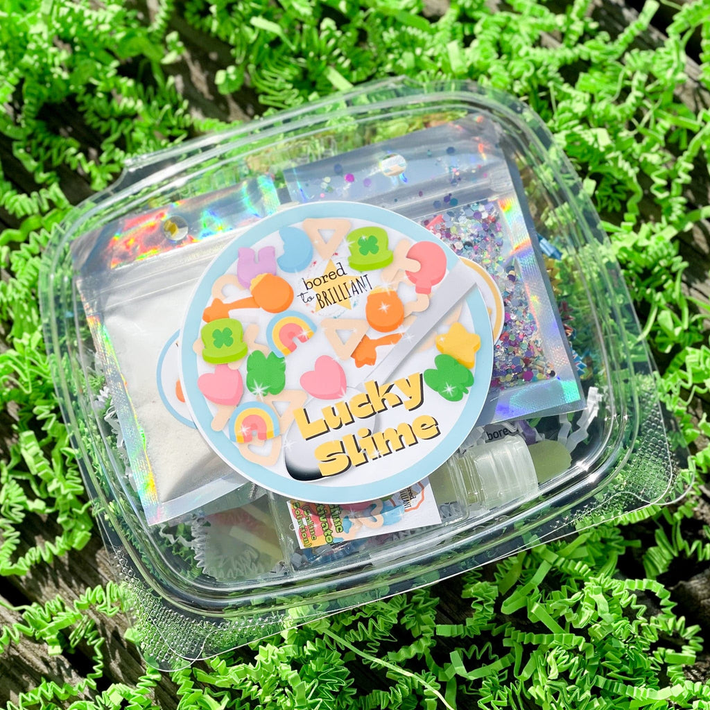 st. patricks day lucky slime container with label on a bed of green grass