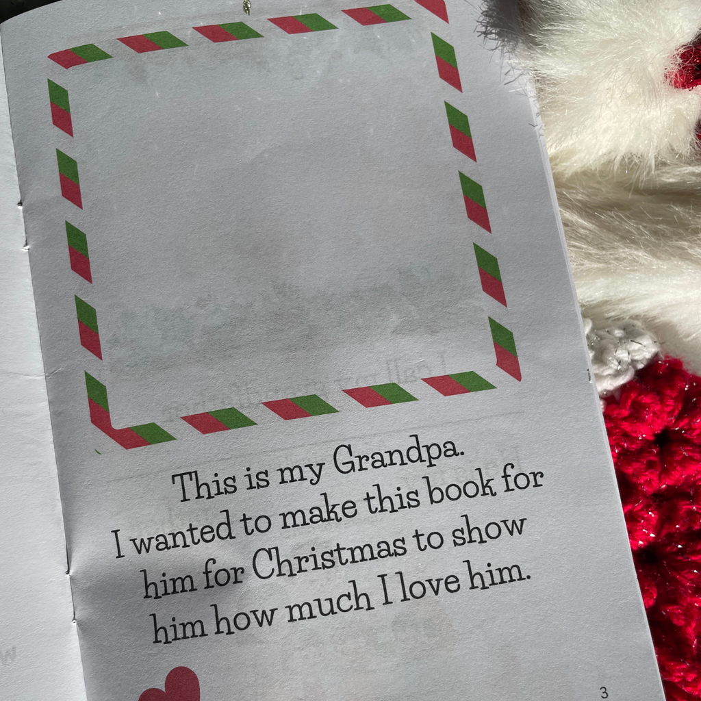 'Merry Christmas Grandpa' book interior page with festive illustrations on a background with snow and stocking