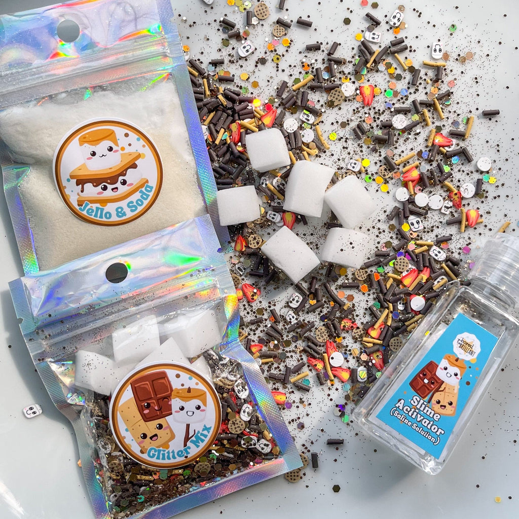 ingredients for diy slime kit in packages with loose confetti and inserts on a table. 