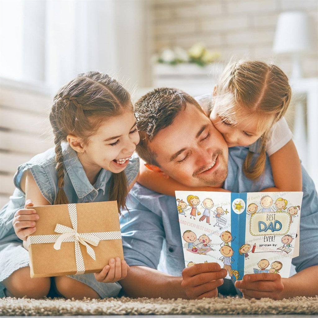 dad and kids looking at gift book