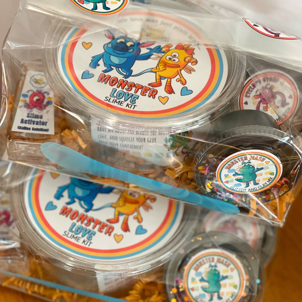 entire packaged product of monster slime kit ready to be shipped, extreme close up so you can see all containers insider the clear package