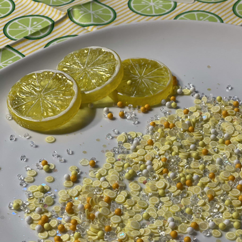 lemons on a plate with a lemon table cloth for lemon slime