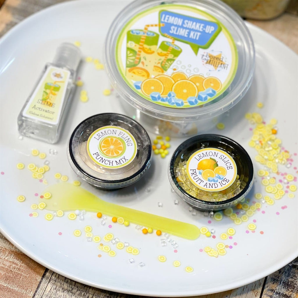 all ingredients to make lemon shake up slime kit on a plate on a table