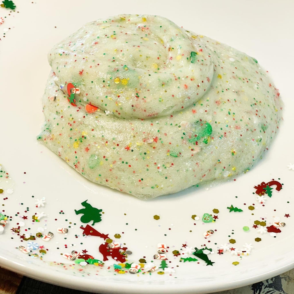 christmas ugly sweater green slime kit on a white plate with confetti